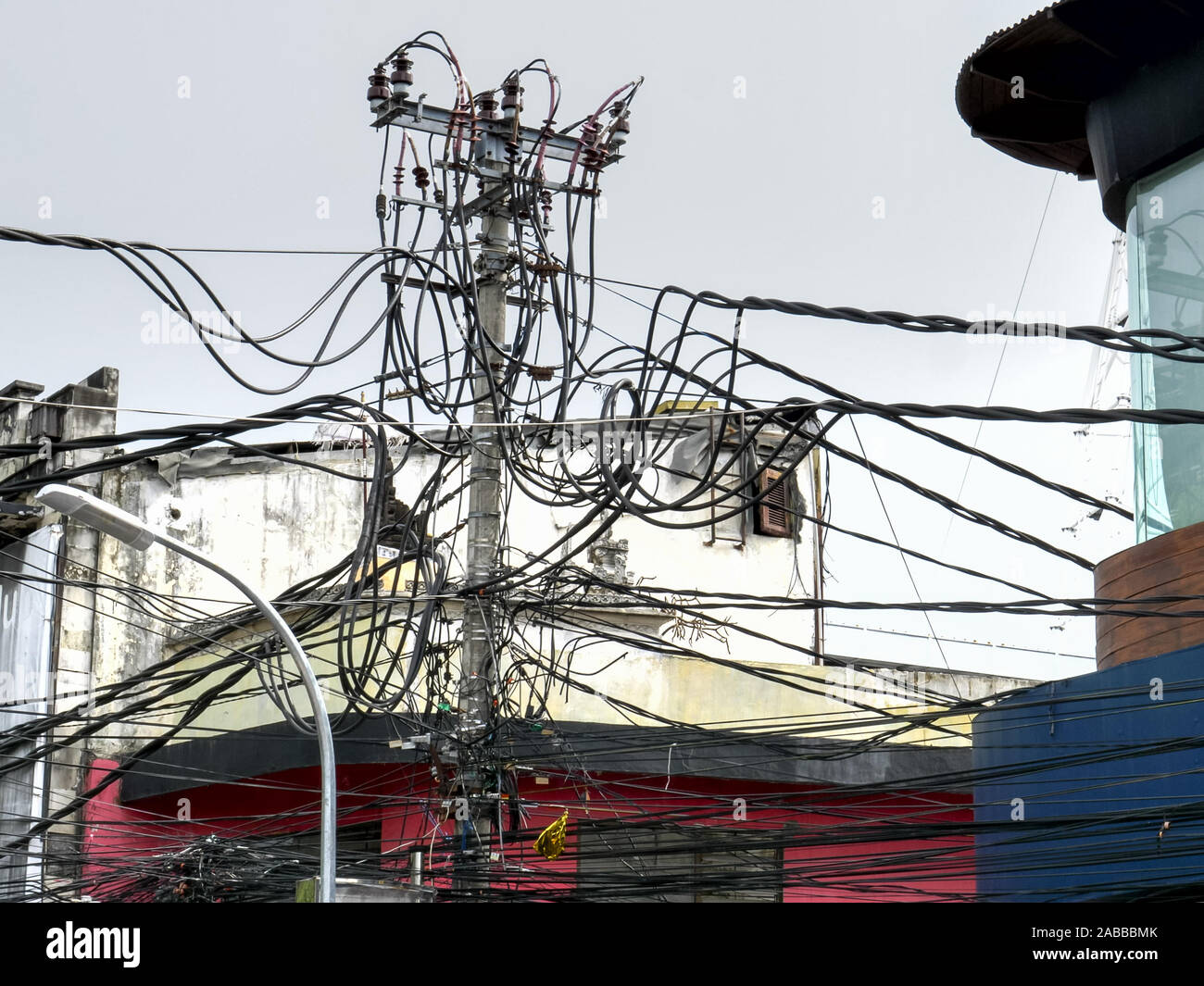 a maze of power lines above the streets of kuta in bali Stock Photo - Alamy
