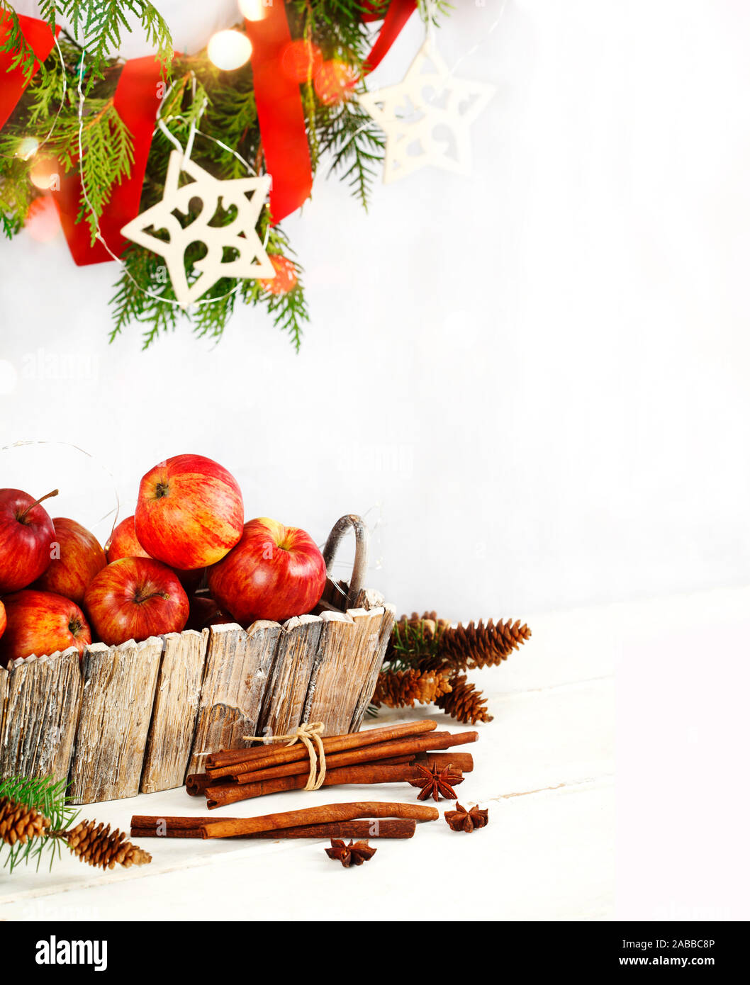 Christmas wreath and decoration with apples, cinnamon and pine cones Stock Photo