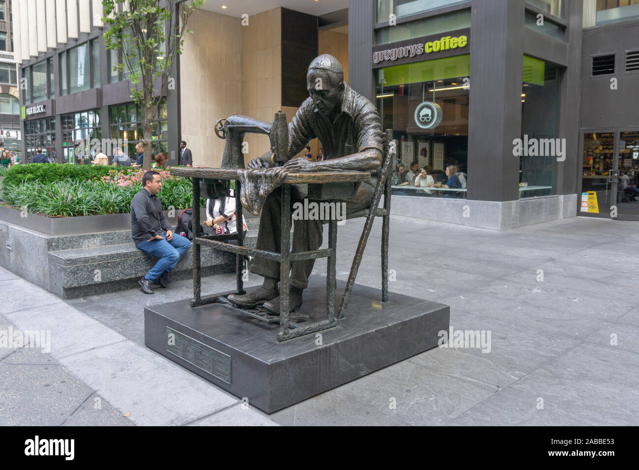 'The Garment Worker by JUDITH WELLER is a sculpture located at 555 Seventh Avenue (also known as Fashion Avenue) in Stock Photo