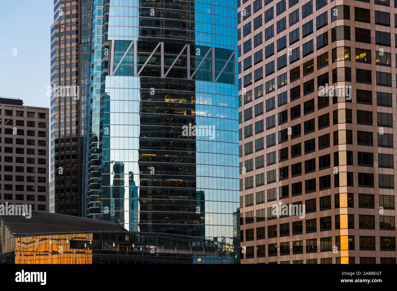 Modern glass and steel office and residential skyscrapers reflect contrasting colors at sunset in downtown Los Angeles, California, USA Stock Photo