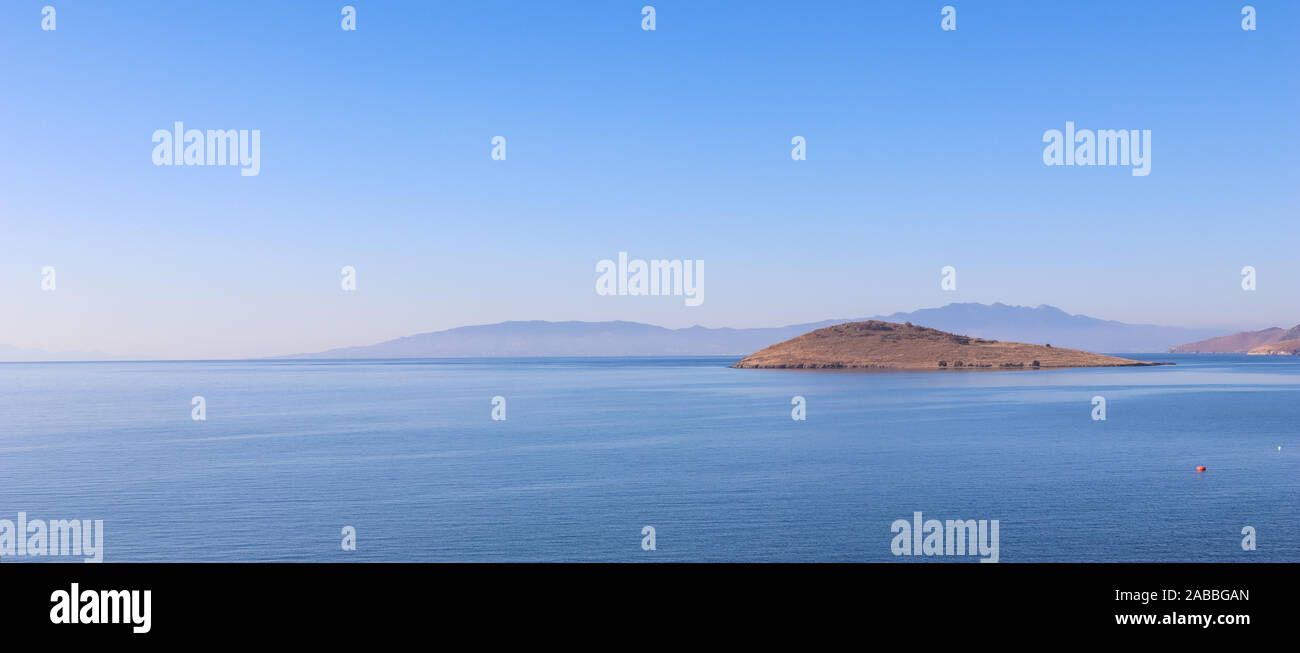 Aegean Sea with calm blue water and islands. Summer holiday concept and travel background Stock Photo