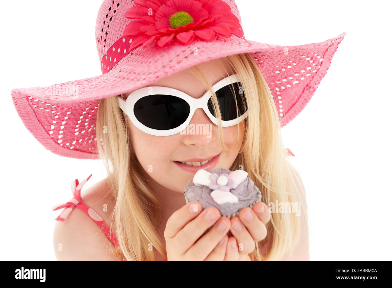 Beautiful young blonde girl in big pink 
