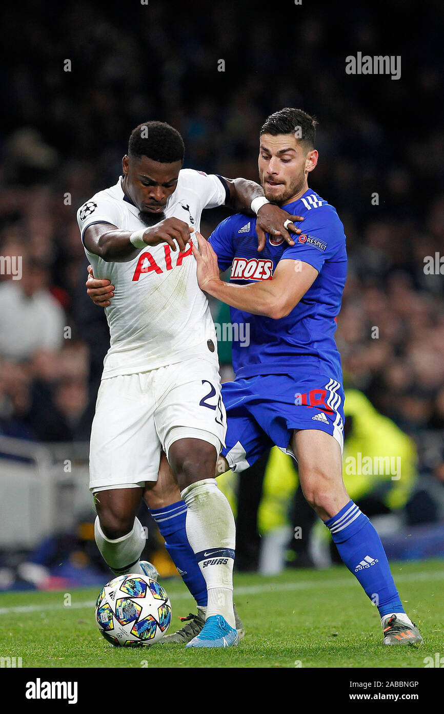 London, UK. 26th Nov, 2019. Giorgos Masouras of Olympiakos gets to grips  with Serge Aurier of Tottenham Hotspur during the UEFA Champions League  Group stage match between Tottenham Hotspur and Olympiacos Piraeus