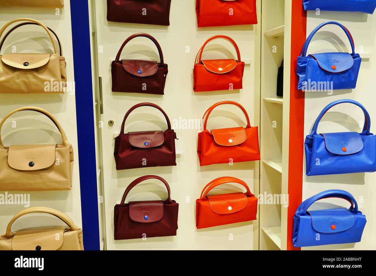 Passerby Wearing Longchamp Orange Net Bag Editorial Stock Photo