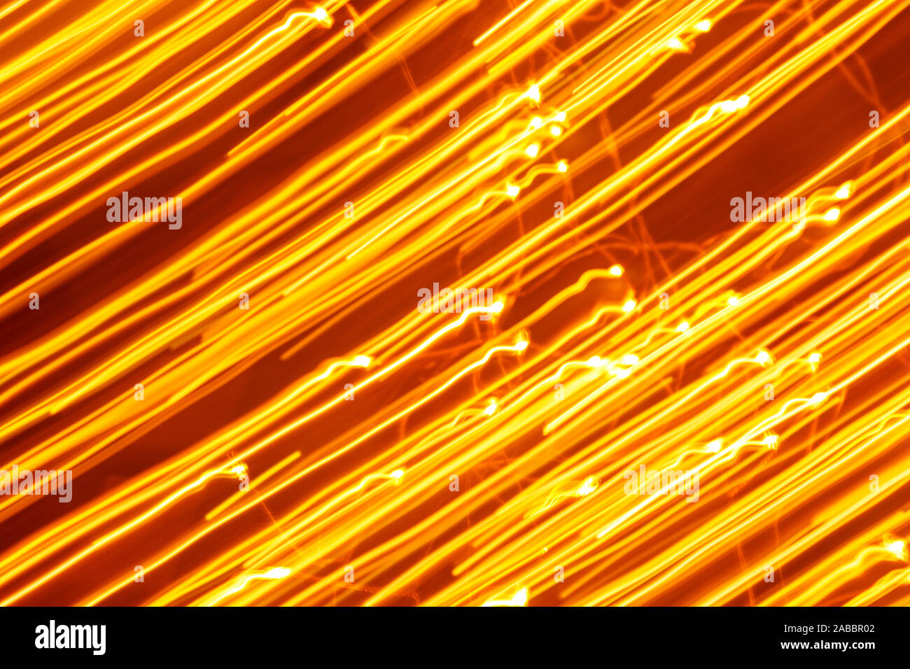 Futuristic blurred lights holiday monochrome background in yellow. Horizontal, soft focus Stock Photo