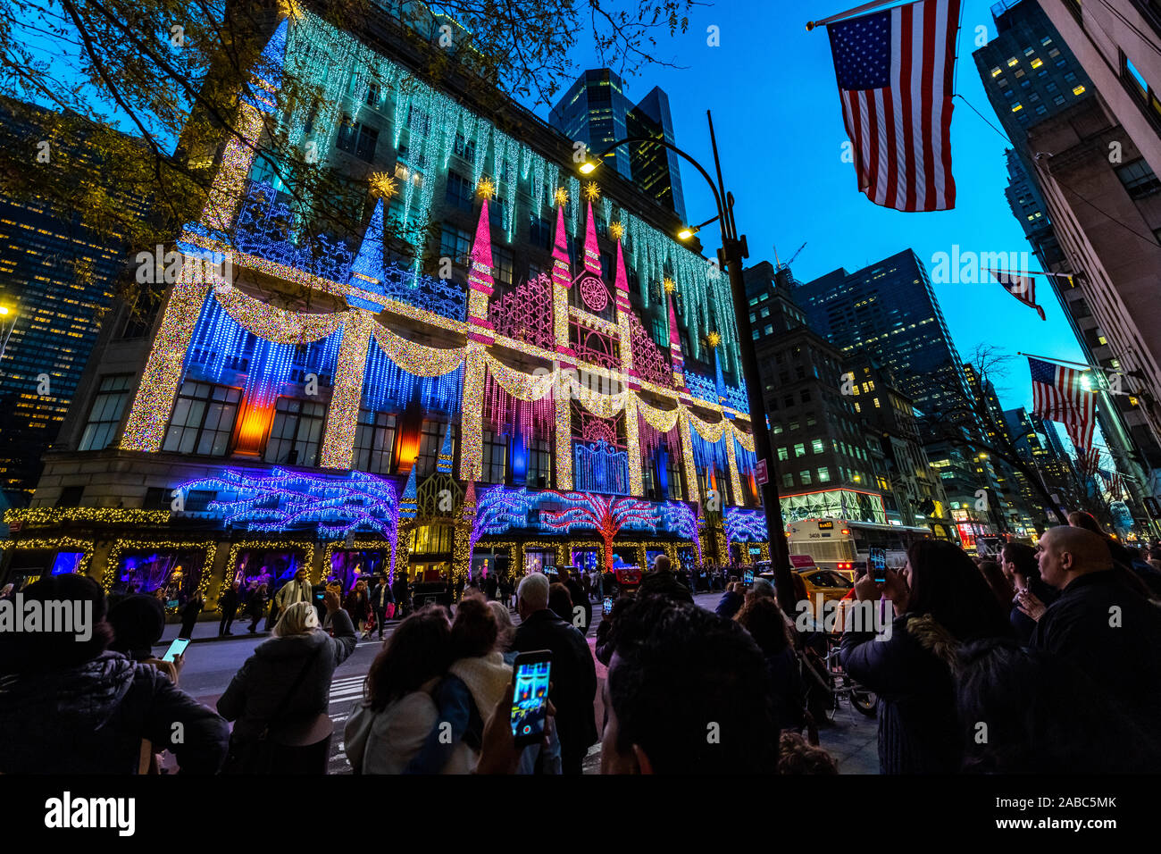 New York, USA,  26 November 2019. People photograph Christmas decorations over Sacks Fifth Avenue department store in New York City.   Credit: Enrique Stock Photo