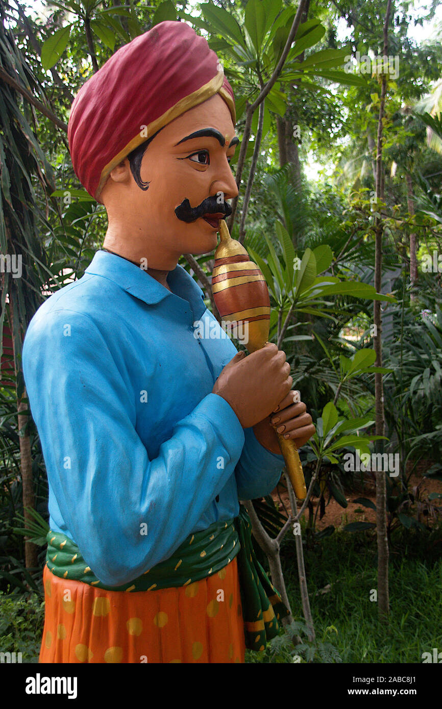 Side view of bust sculpture of Bean Instrument Player at Janapada Loka ...