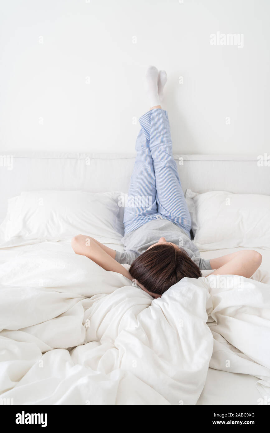 Woman with pillow under legs hires stock photography and images Alamy