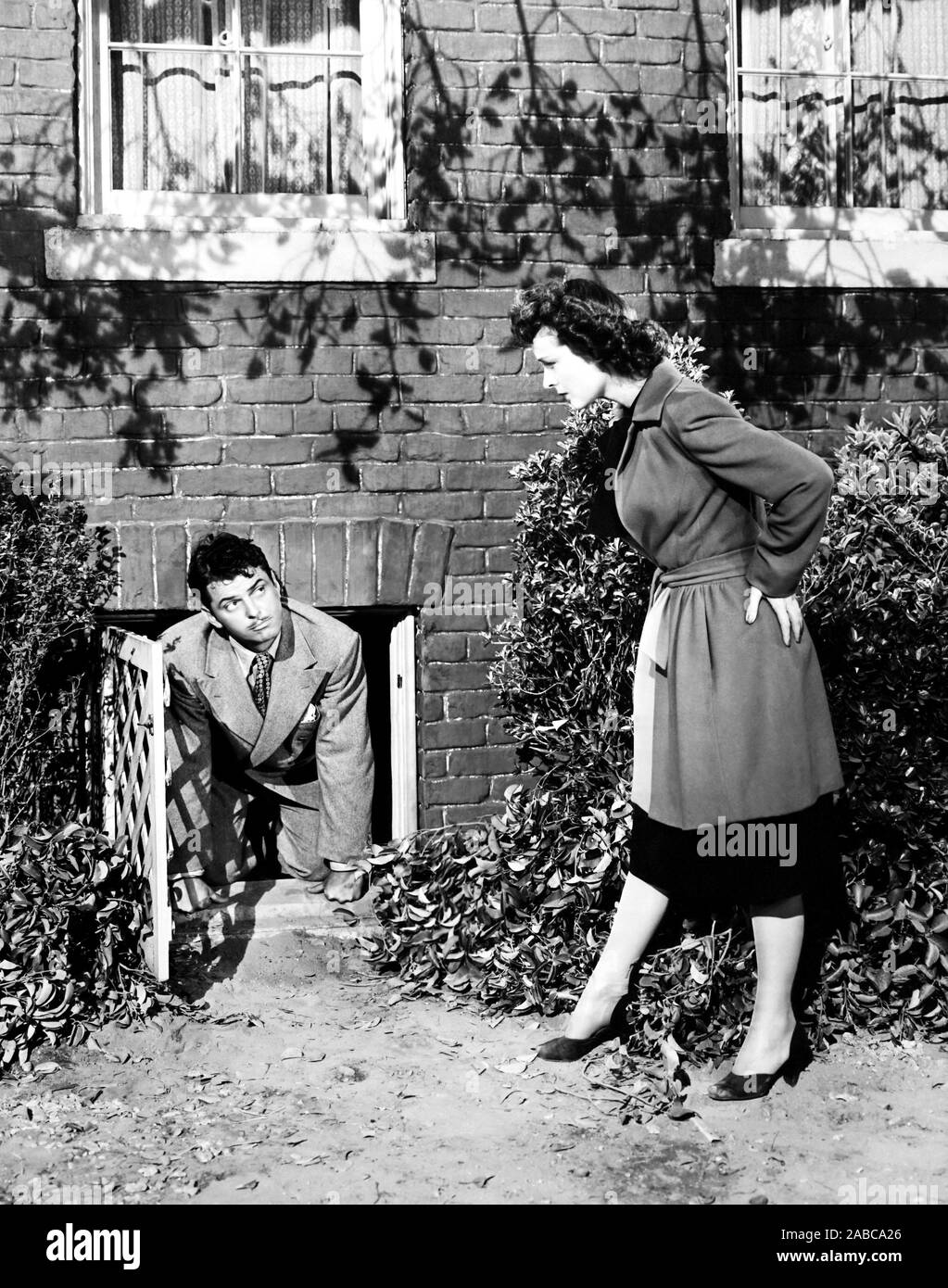 BEDSIDE MANNER, from left, John Carroll, Ruth Hussey, 1945 Stock Photo