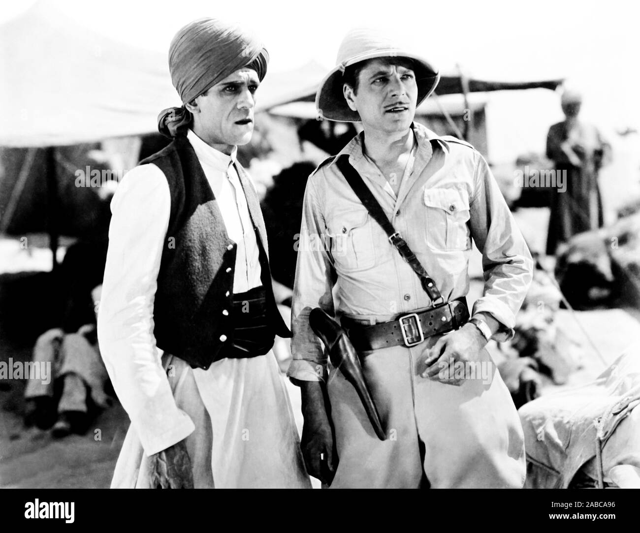 BEHIND THAT CURTAIN, from left, Boris Karloff, Warner Baxter, 1929, TM ...