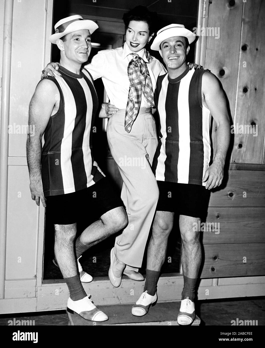 DEEP IN MY HEART, Ann Miller visits brothers Fred Kelly (left) and Gene