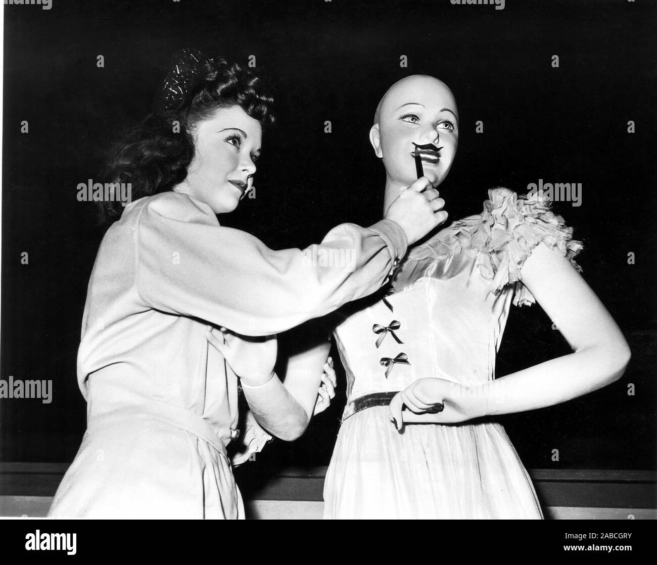EASY TO LOOK AT, Gloria Jean, decorating a mannequin on-set, 1945 Stock ...