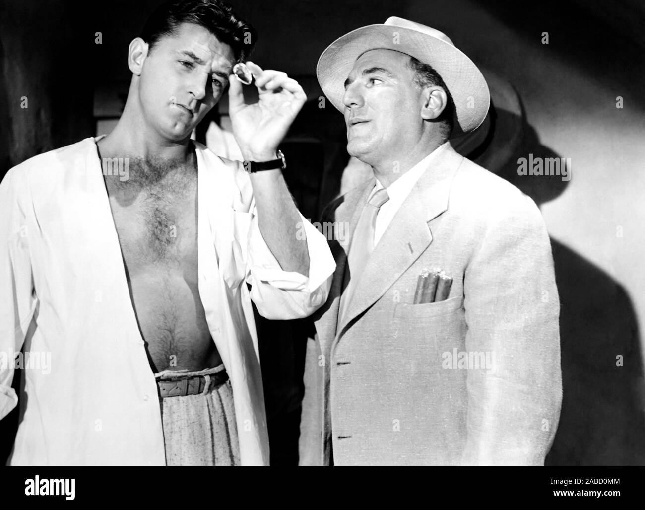 MACAO, from left, Robert Mitchum, William Bendix, 1952 Stock Photo - Alamy