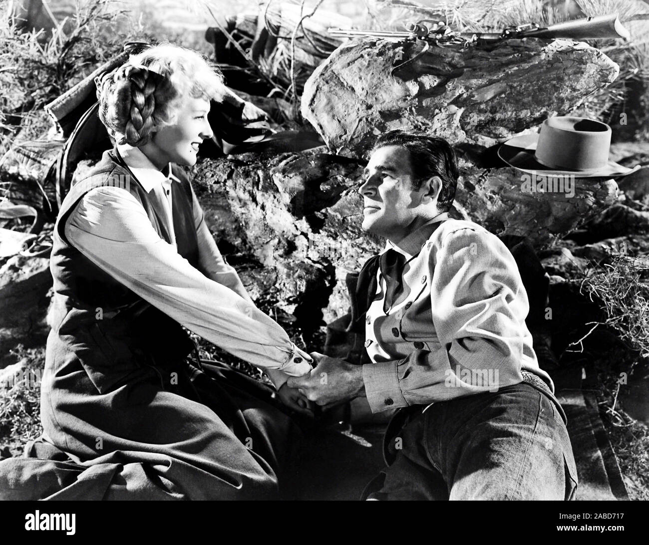 Rod Cameron Explosion THE PLUNDERERS, from left, Ilona Massey, Rod Cameron, 1948 Stock Photo ...