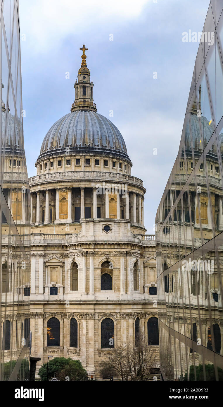 London, England - January 14, 2018: View of St. Paul's Cathedral from One New Change shopping centre on a cloudy day with reflection in glass walls Stock Photo