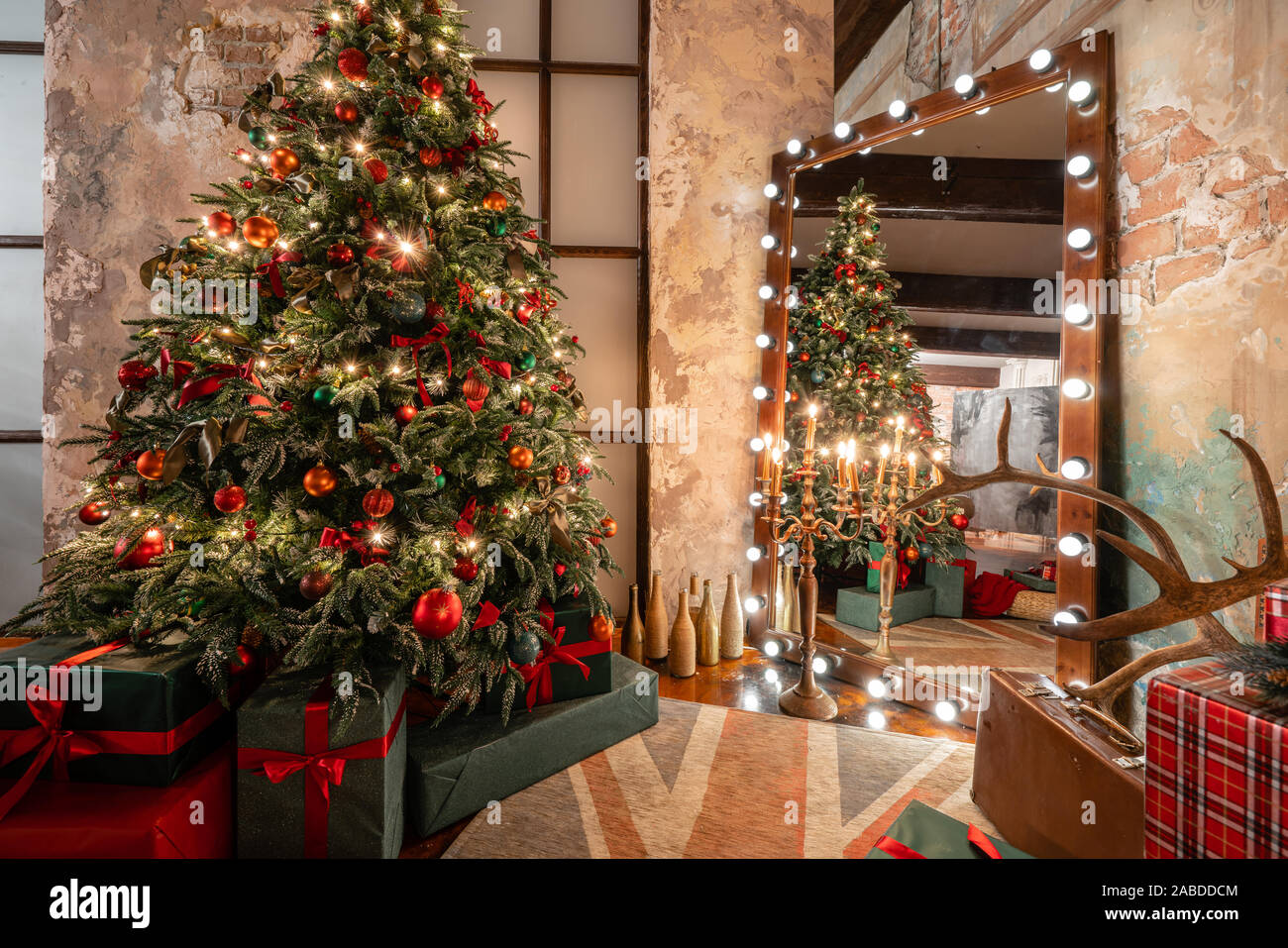 Winter home decor. Christmas in loft interior against brick wall ...