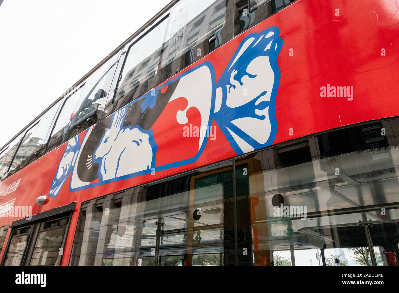 A sightseeing bus with the elements of White Rabbit Canday, a brand of ...
