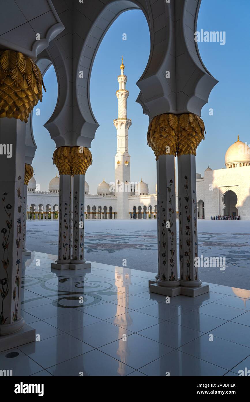 Beautiful golden pillars along the Abu Dhabi Grand Mosque. Stock Photo