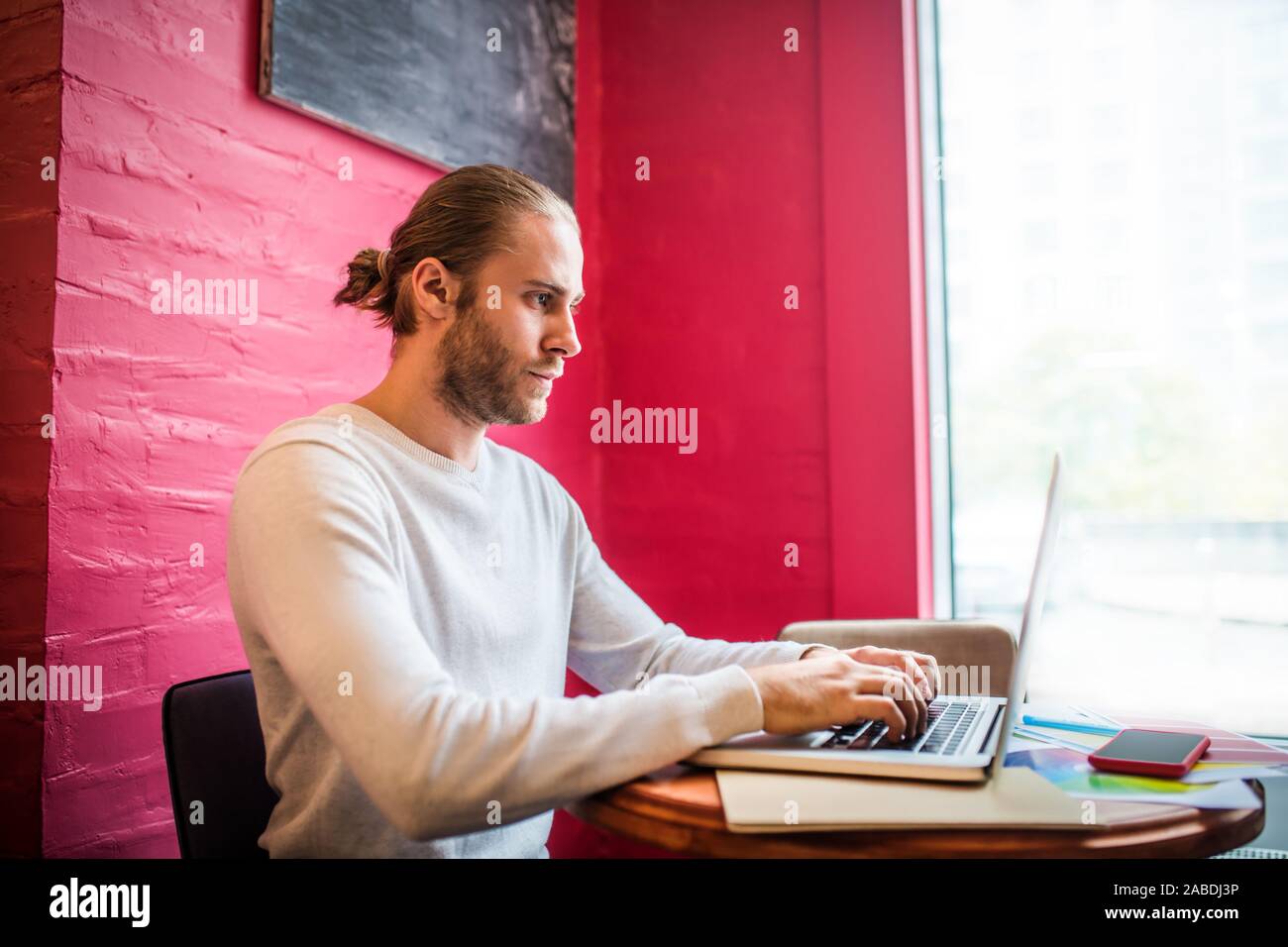 Bearded freelancer feeling busy while working having deadline Stock Photo