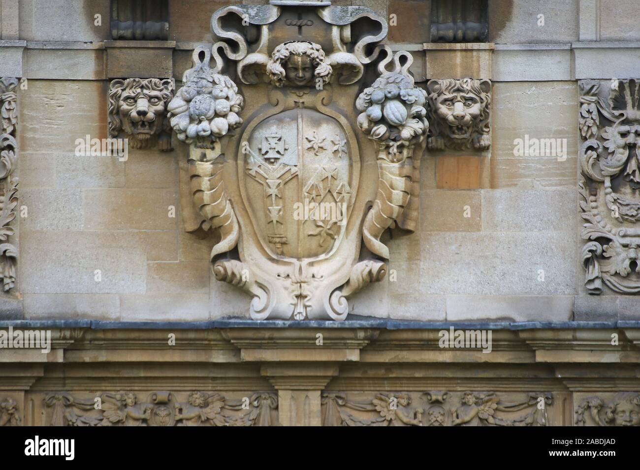 stonework above an entrance in St John's college Oxford with the coat of arms of Archbishop Laud and the Archbishop of Canterbury Stock Photo