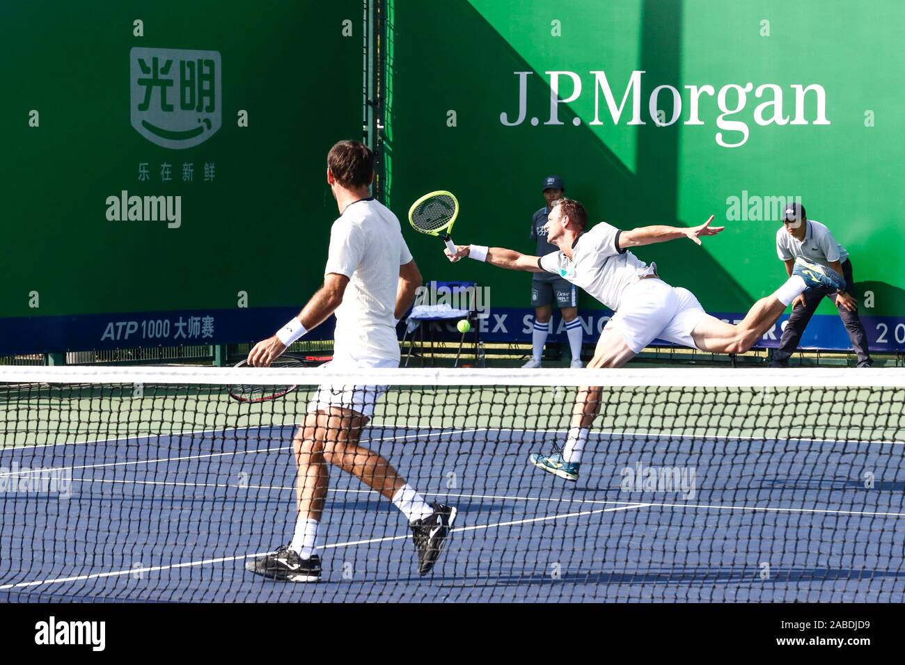 Ivan Dodig of Crotia and Filip Polasek of Slovakia compete against Jean ...