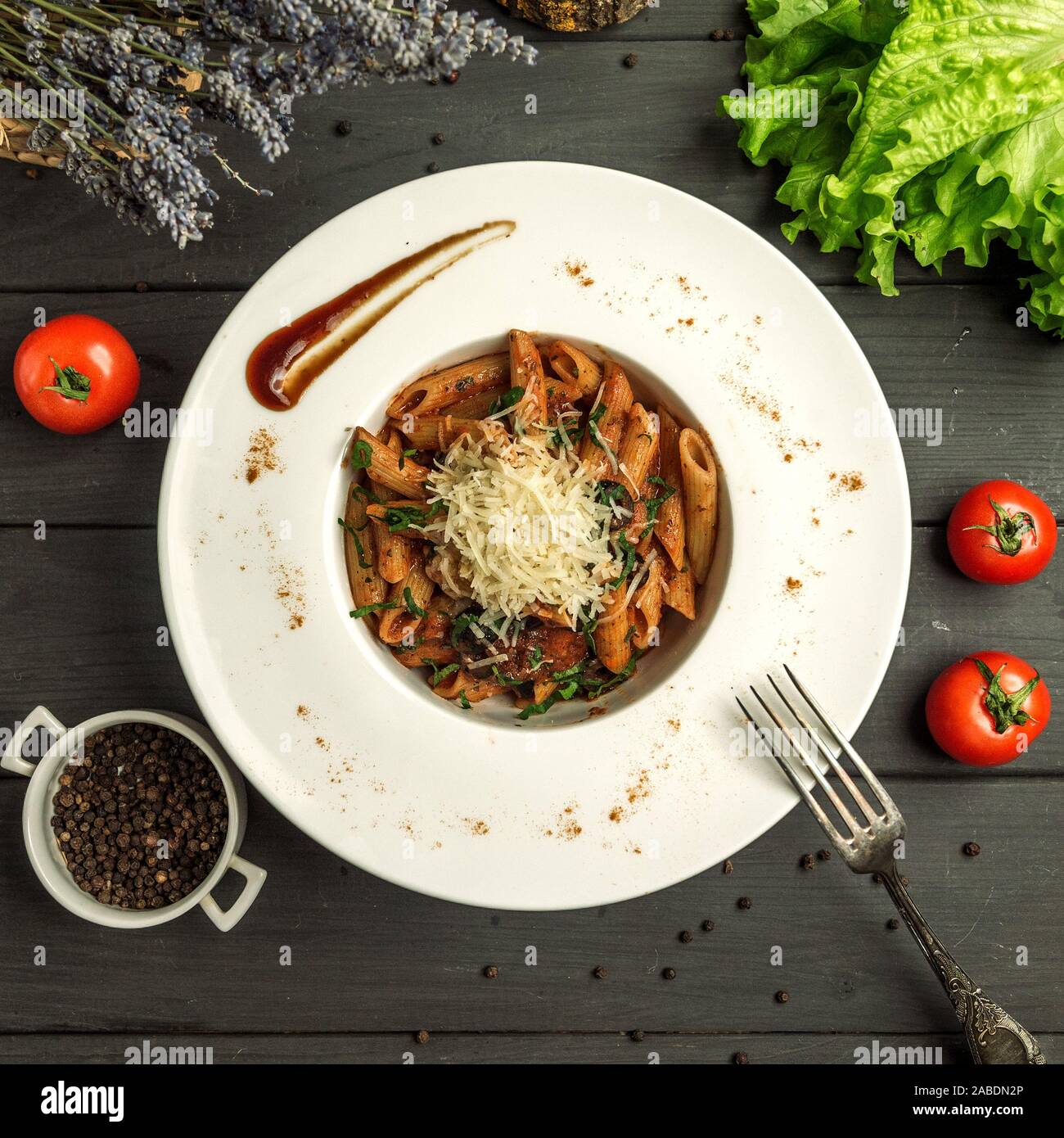 penne pasta with tomato sauce, beef and grated cheese Stock Photo - Alamy