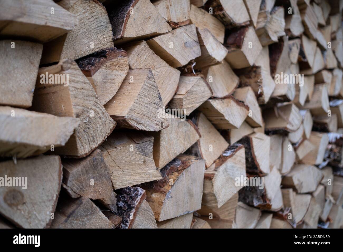 Woodpile with fireplace wood stacked. alternative, renewable energy Stock Photo