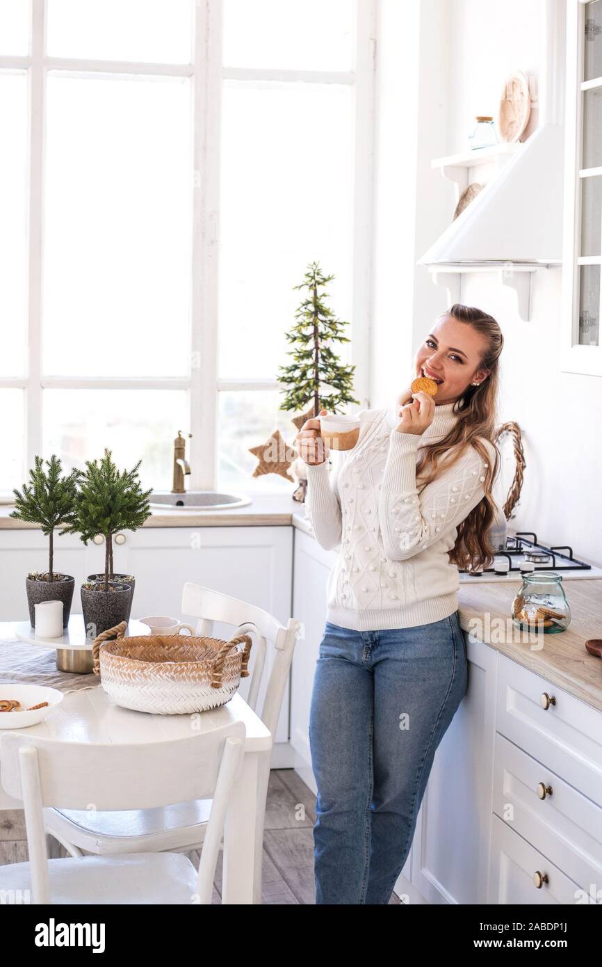Beautiful Young Woman Drink Tea At The Festive Kitchen Christmas And New Year Concept Stock Photo Alamy