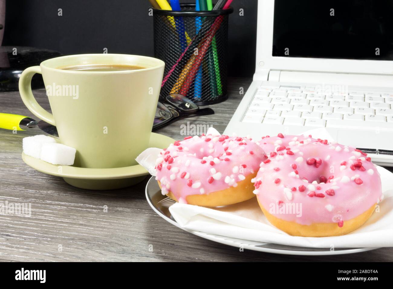 Computer, coffee and donuts Stock Photo - Alamy