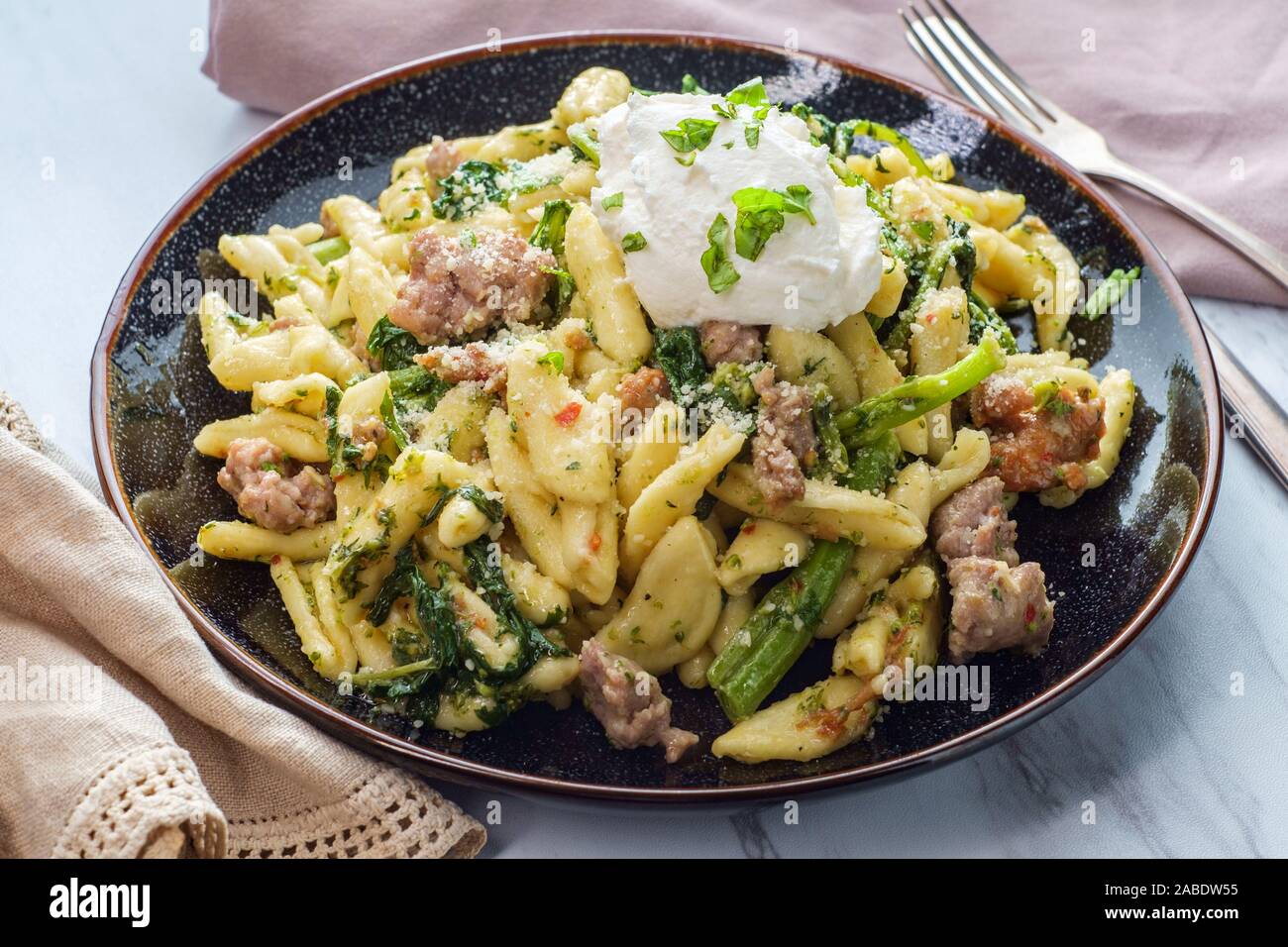 Italian spicy sausage ricotta cavatelli pasta and broccoli rabe Stock
