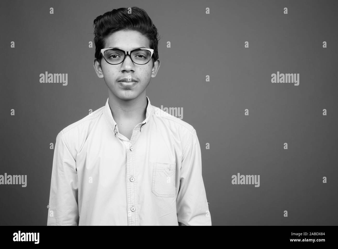 Young Indian boy looking smart in black and white Stock Photo