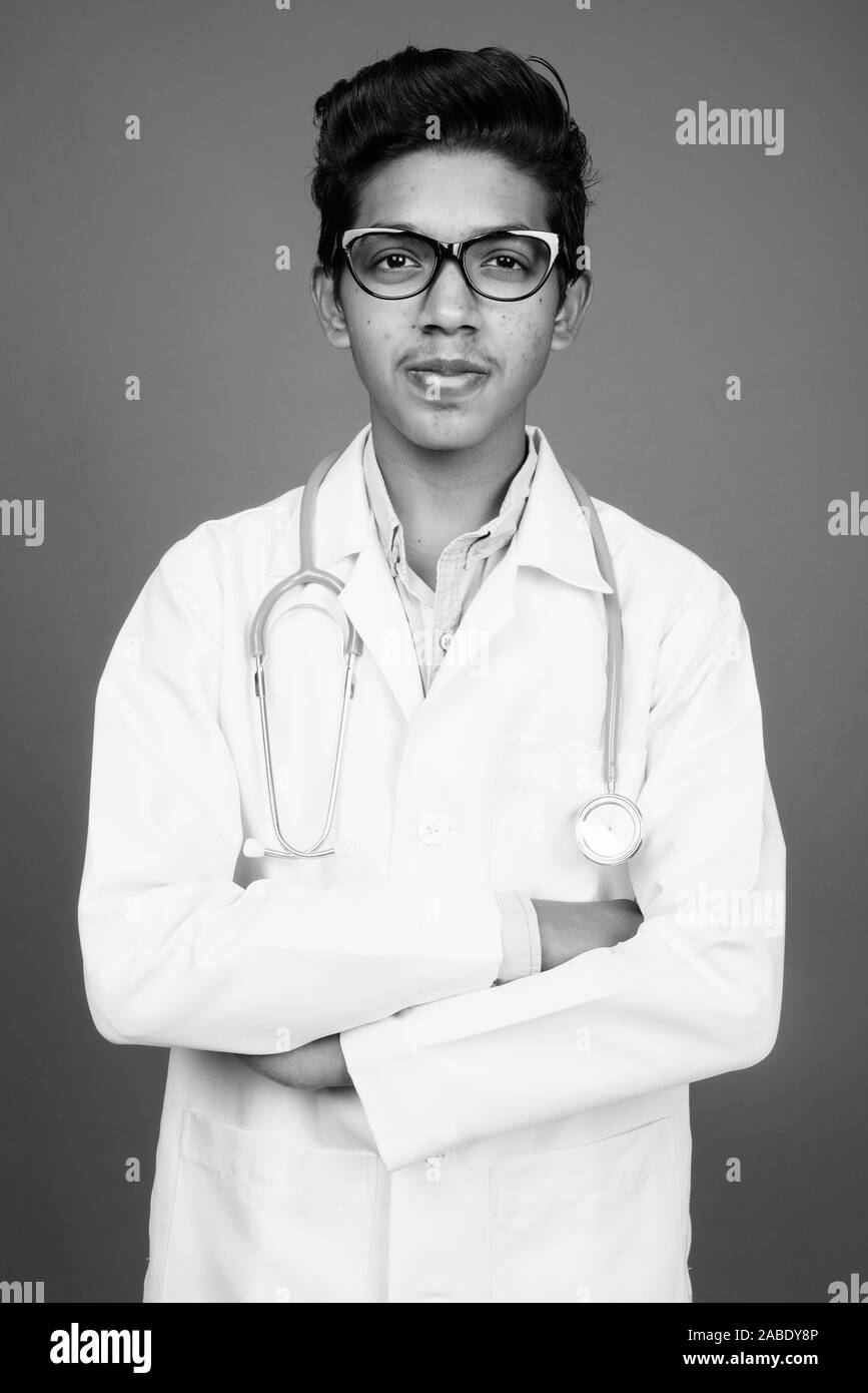 Young Indian boy doctor with eyeglasses in black and white Stock Photo