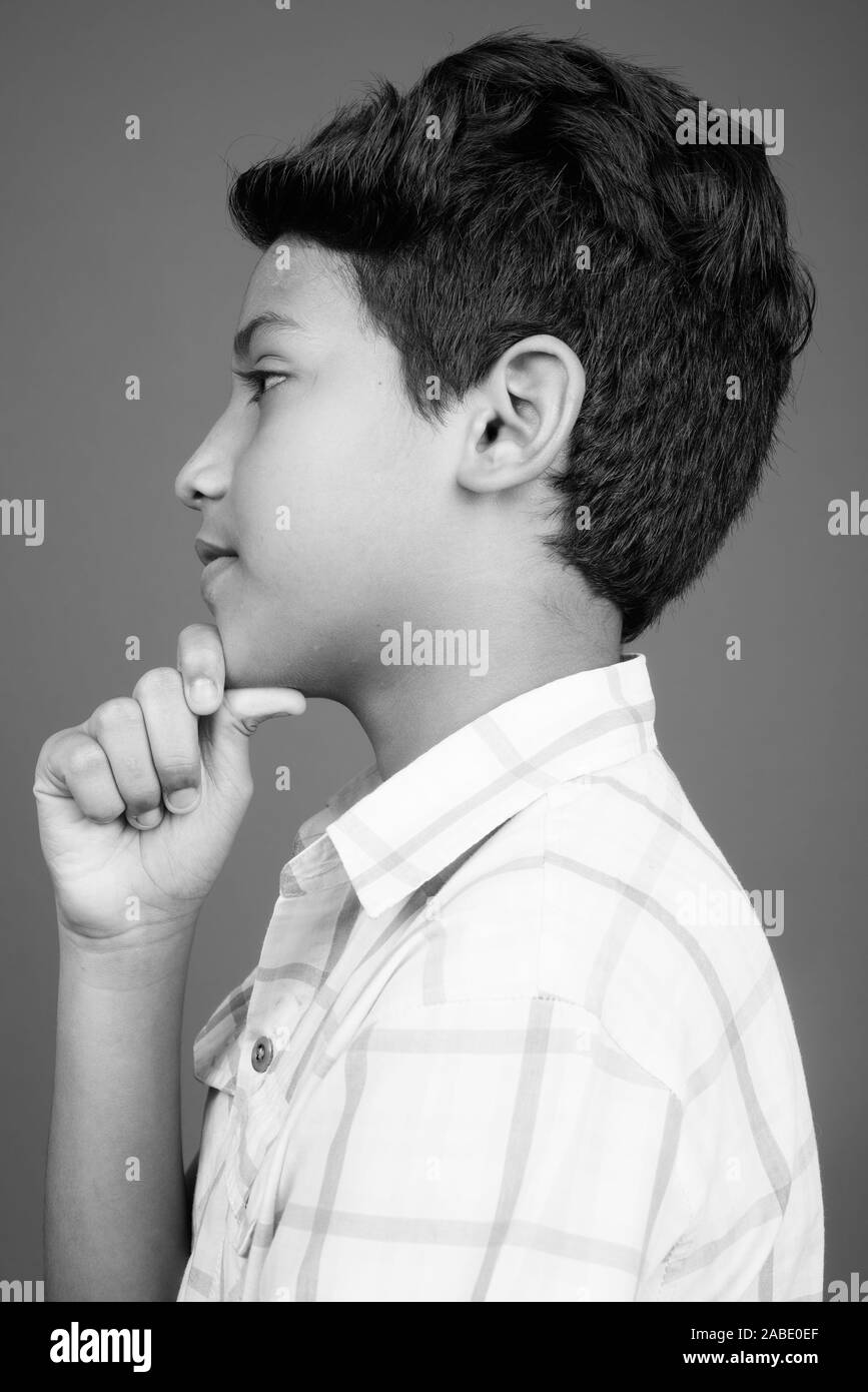 Profile of a Teenage Indian Boy Looking at outsides Stock Photo