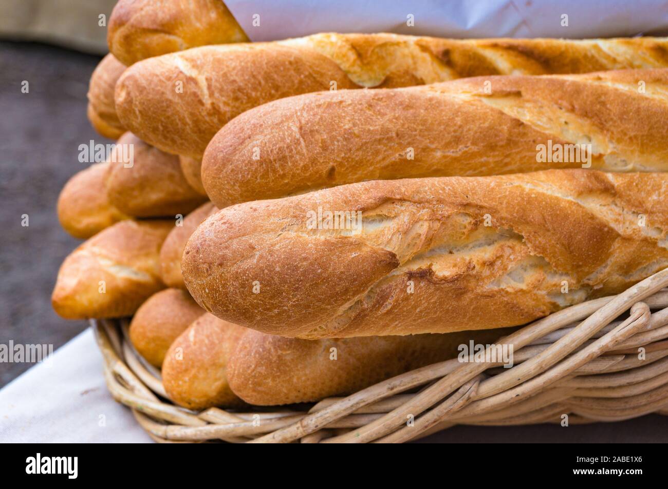 Fresh baguettes, French sticks on display. Food background Stock Photo