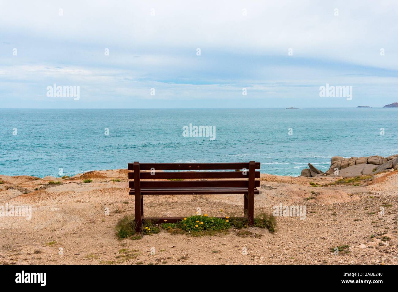 Empty bench with picturesque view towards the open ocean, sea ...