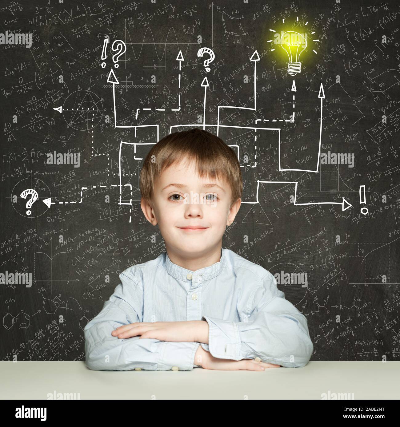 School boy with question signs and light idea bulb, education concept Stock Photo