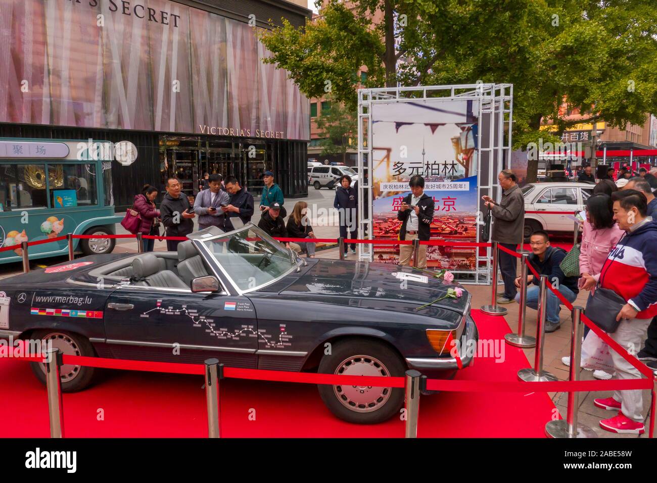 Local citizens visit the cars taking rally race at Wangfujing, a ...