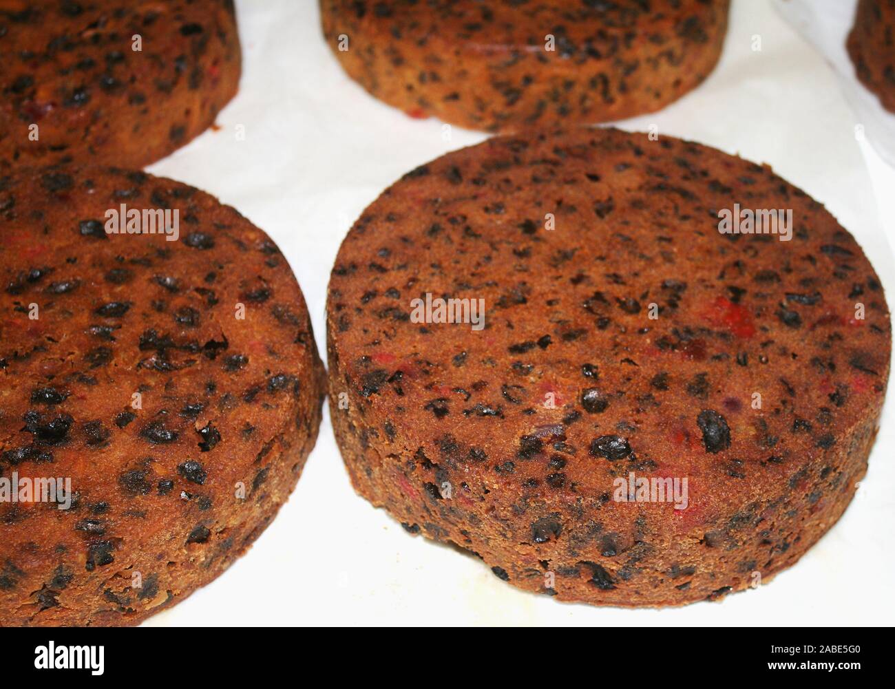 traditional rich fruit cakes ready for icing and decoration at Christmas time Stock Photo