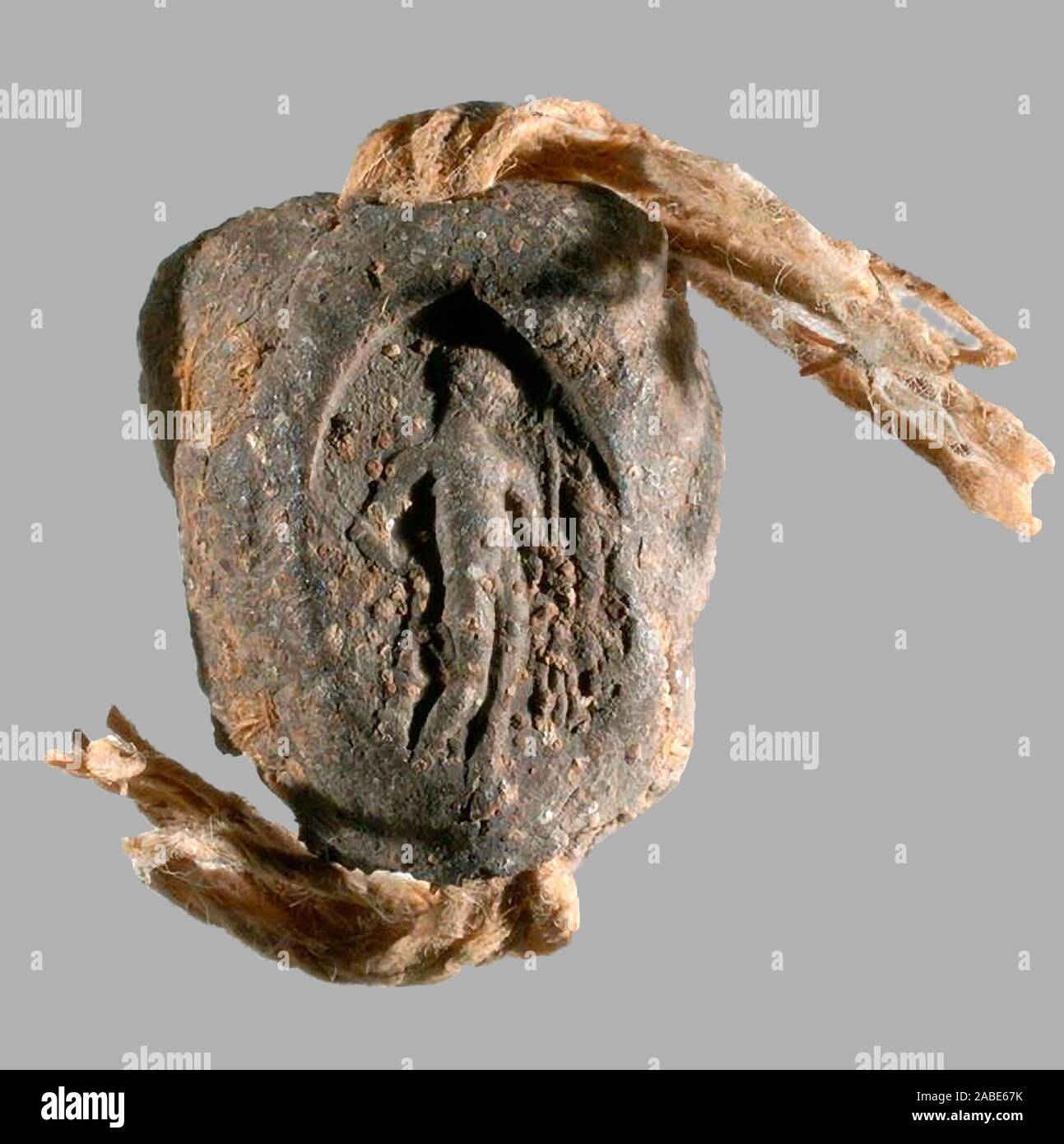 6538. Clay seal impression (bulla) that sealed an Aramaic papyrus letter dating c. 4th. C. BC. Stock Photo