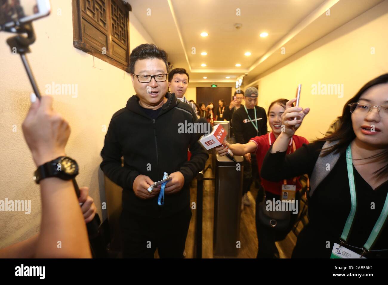 Chinese billionaire businessman Ding Lei, also known as William Ding, the founder and CEO of NetEase (163.com), middle, arrives at Wuzhen to attend th Stock Photo