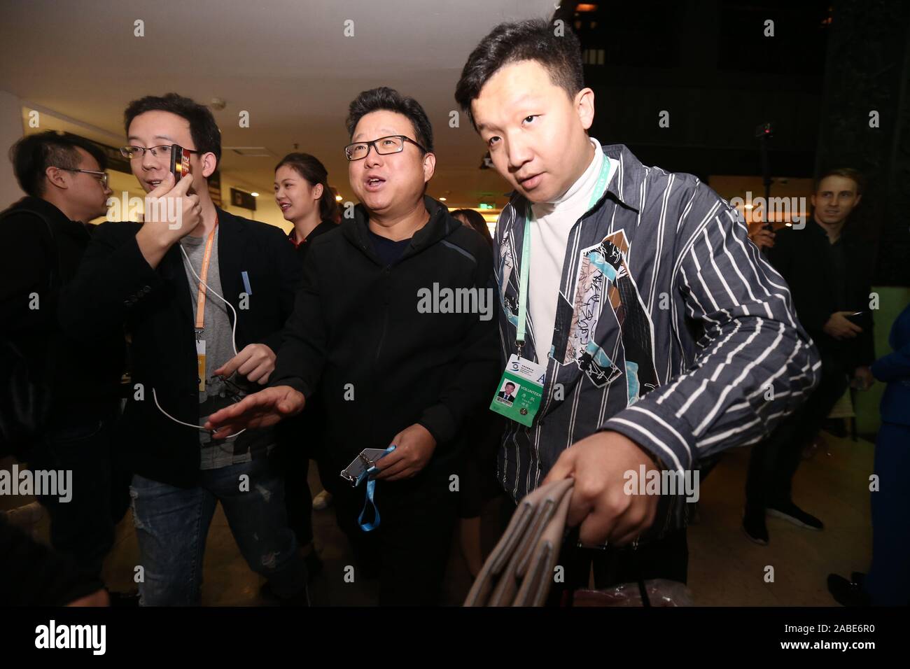 Chinese billionaire businessman Ding Lei, also known as William Ding, the founder and CEO of NetEase (163.com), middle, arrives at Wuzhen to attend th Stock Photo