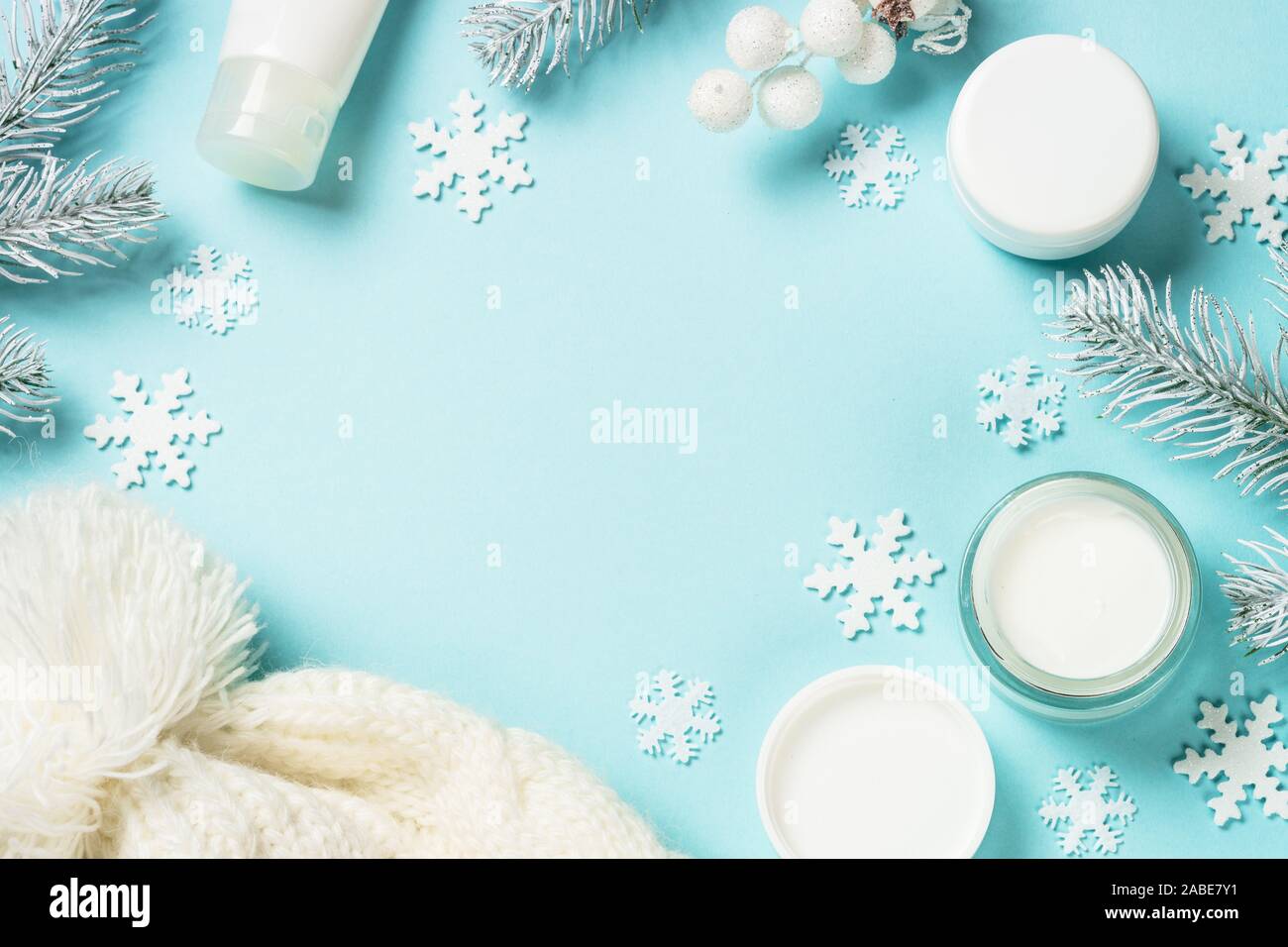 Winter cream for skin on blue top view. Stock Photo