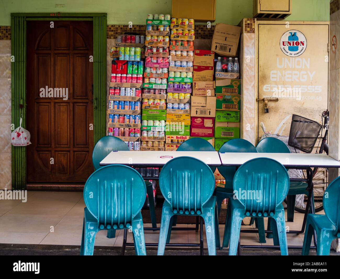 SINGAPORE – 9 MAY 2019 – Empty tables and chairs and boxes of canned drinks at a traditional coffeeshop / kopitiam / casual eatery in Singapore. These Stock Photo