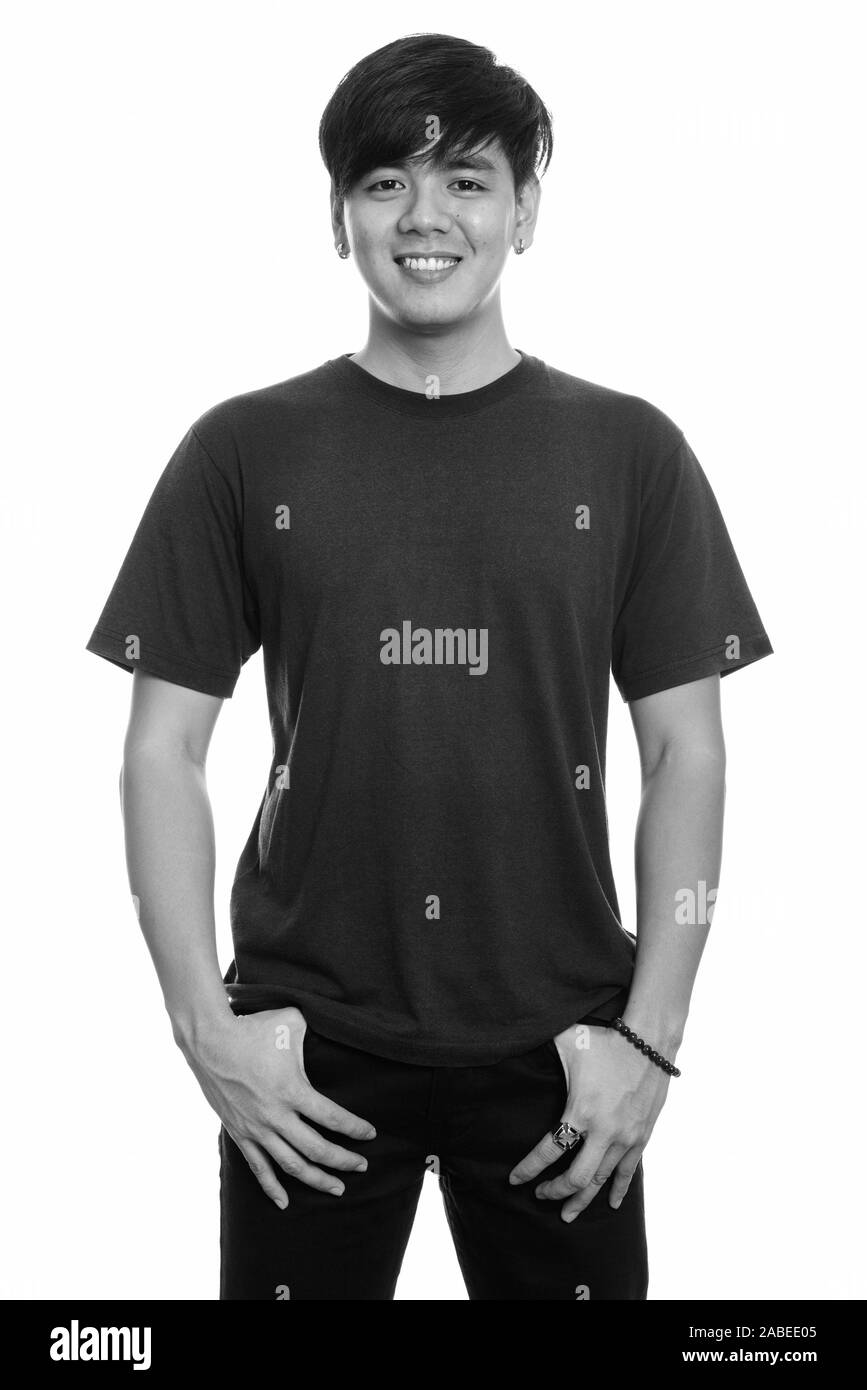 Studio shot of young happy Asian man smiling Stock Photo - Alamy