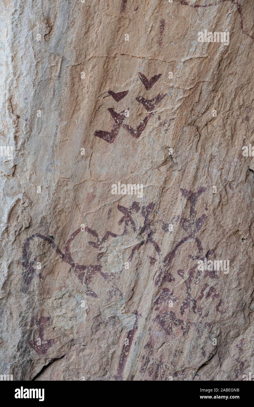 Ancient cave paintings at Cueva de Los Letreros, Almeria Spain. Approx. 5,000 years old, painted with iron oxide (ochre) Stock Photo