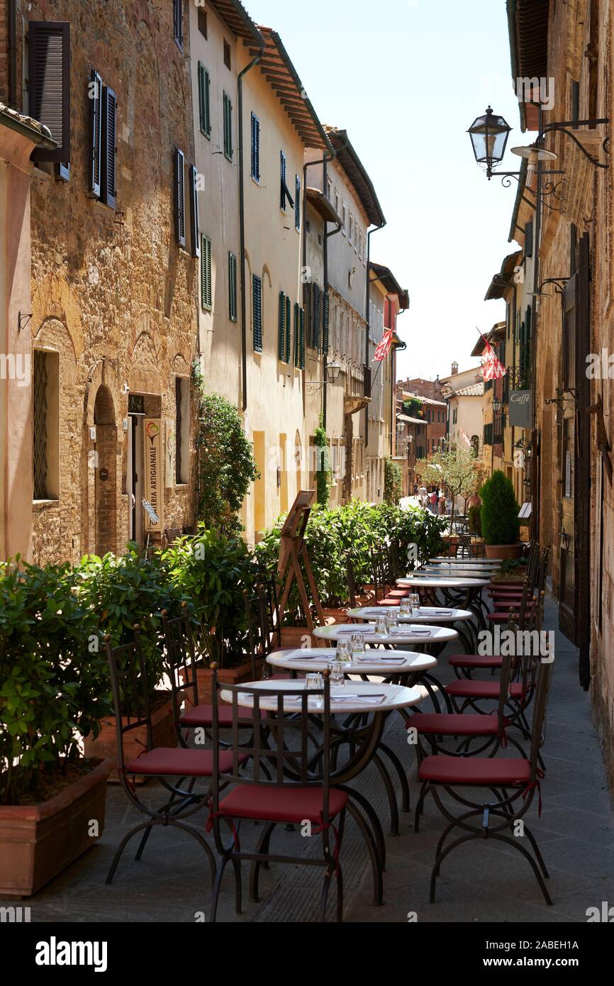 Outdoor restaurant tables and architecture of the Tuscan village of San  Quirico d'Orcia in the Val d'Orcia Tuscany Italy - Tuscany tourism street  Stock Photo - Alamy, image size:866x1390
