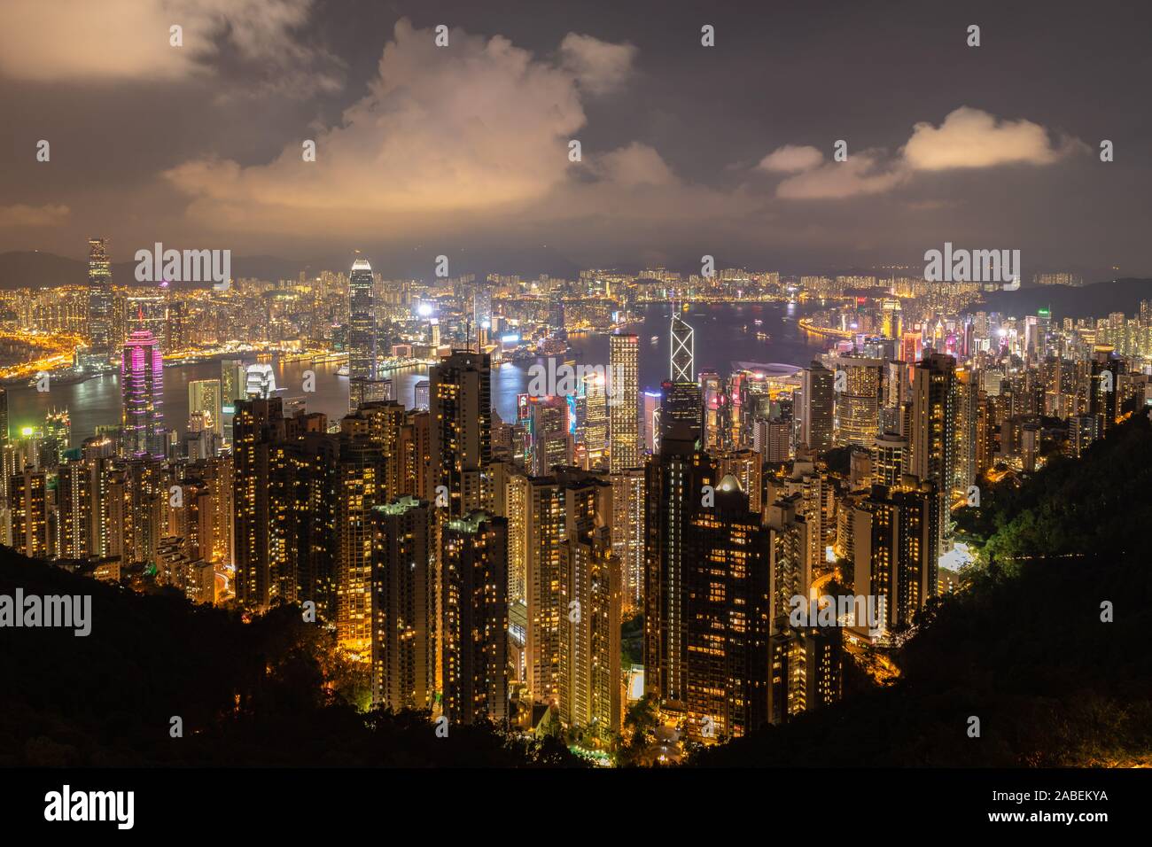 Night view of the Victoria Habour with many skyscrapers on top of Victoria Peak in Hong Kong Special Administrative Region, China Stock Photo