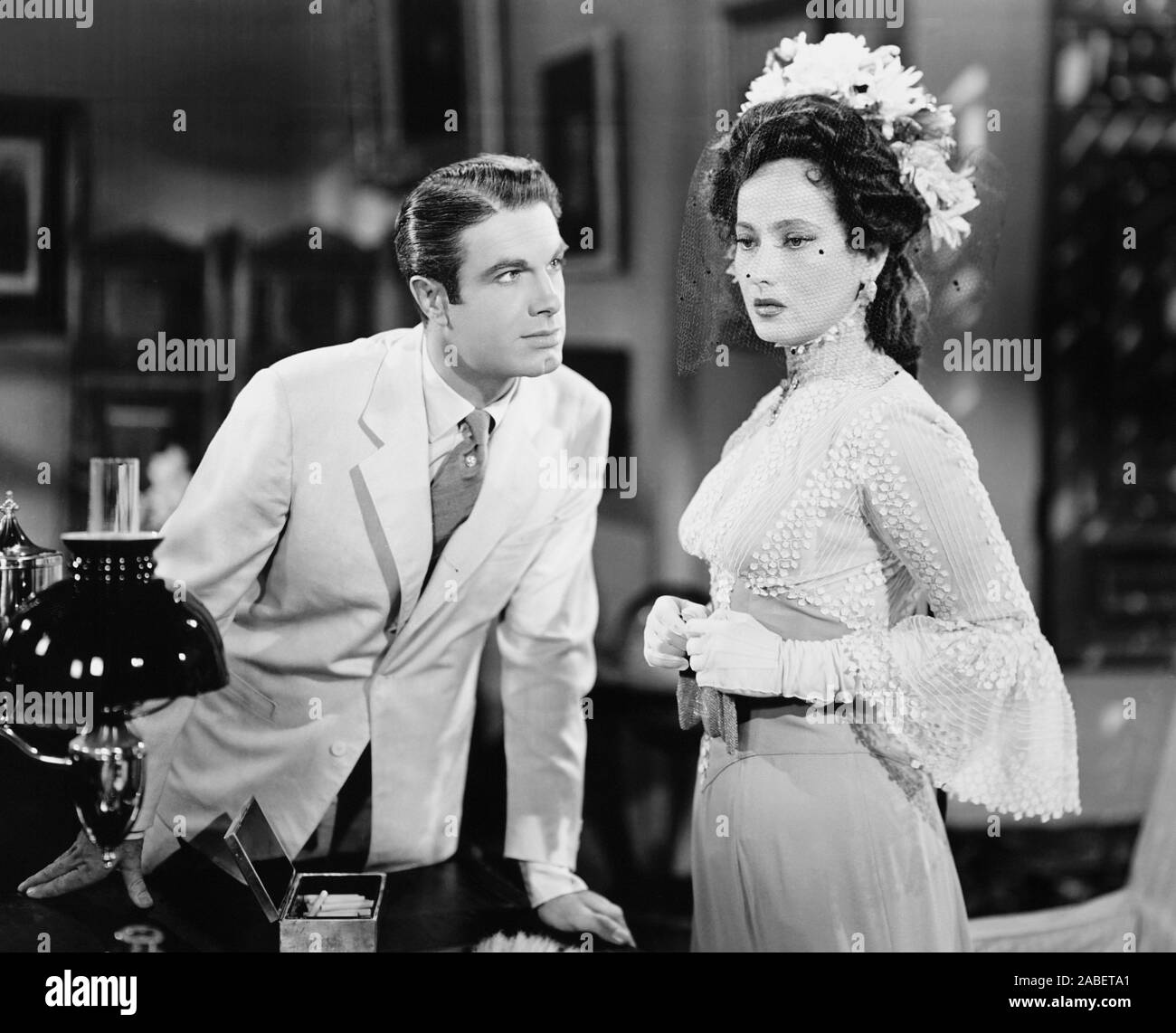 TEMPTATION, from left: Charles Korvin, Merle Oberon, 1946 Stock Photo ...