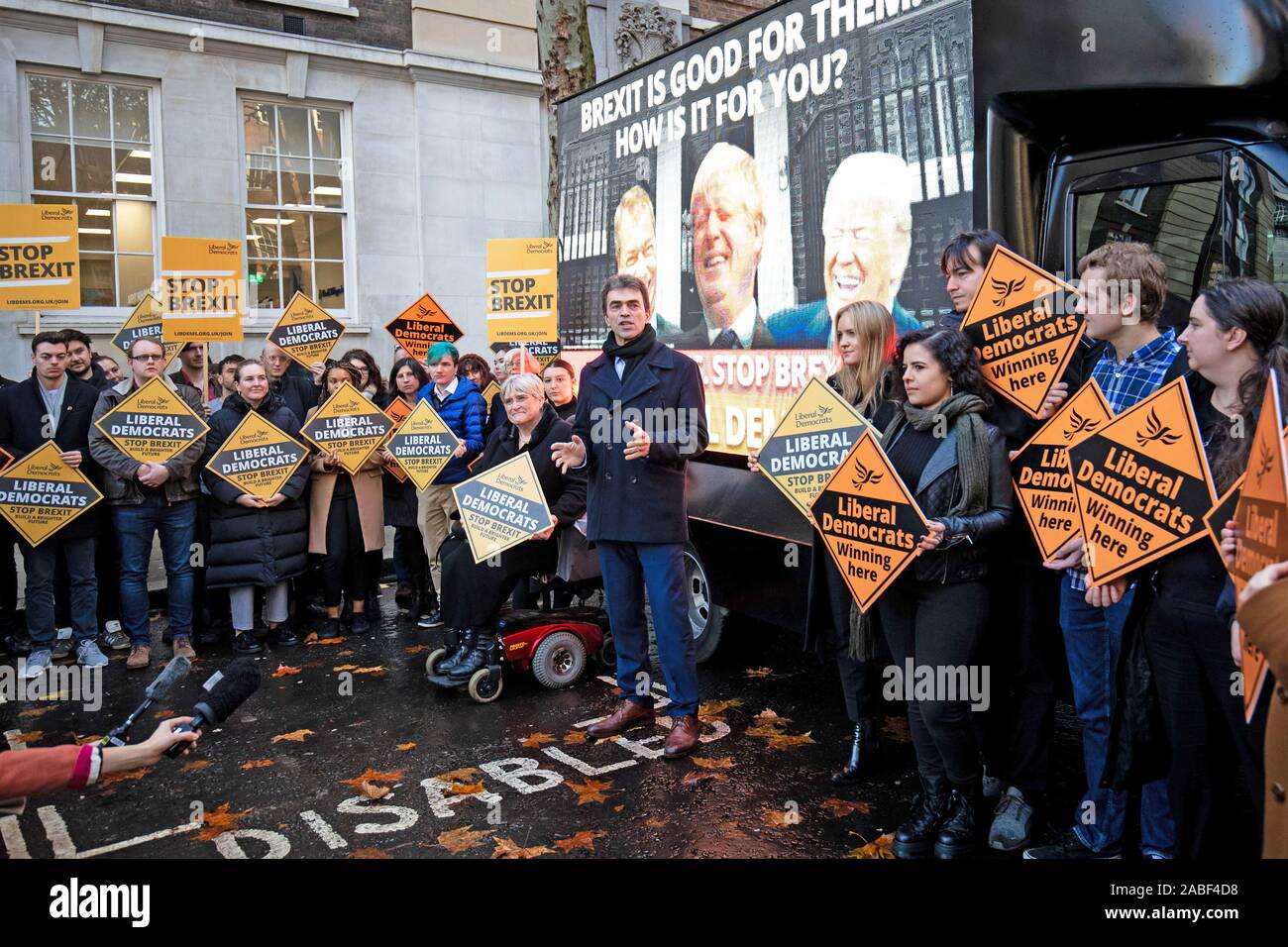 Liberal Democrat Brexit spokesperson Tom Brake (centre) in Smith Square, Westminster, as the party launches four poster vans that are set to tour Liberal Democrat/Conservative marginal seats. Stock Photo