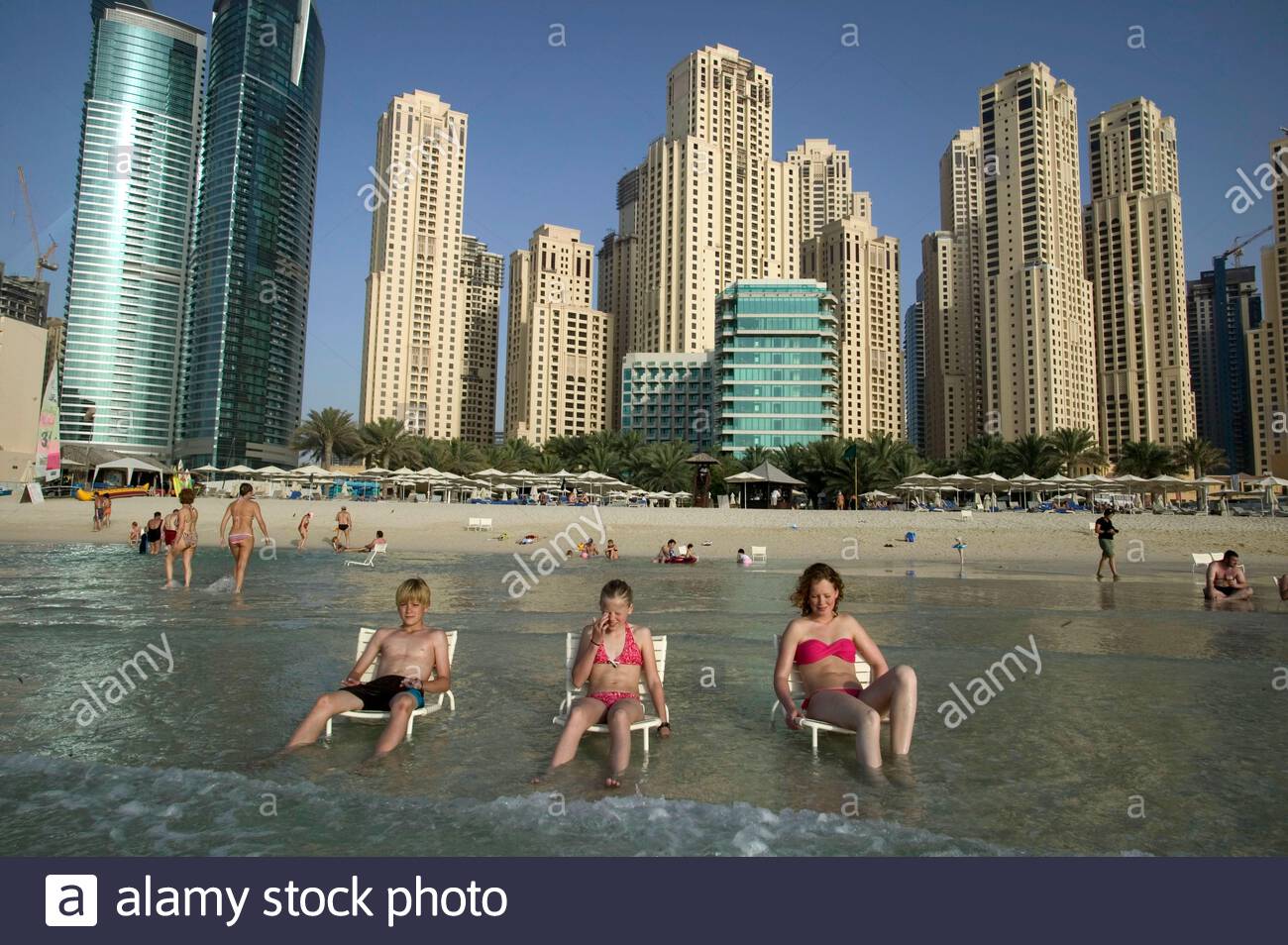 Visitors Cool Down By Taking The Chairs In The Water In Jumeirah
